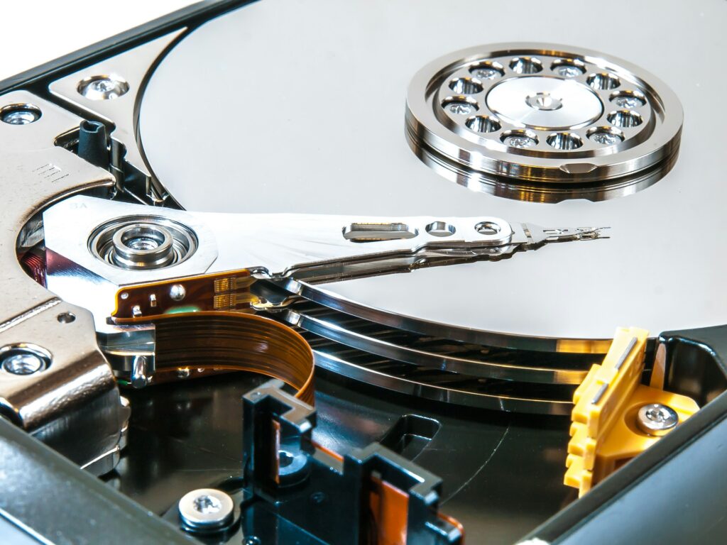 Shows a hard disk drive with spinner and arm